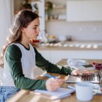 Young woman having homeoffice in an apartment.